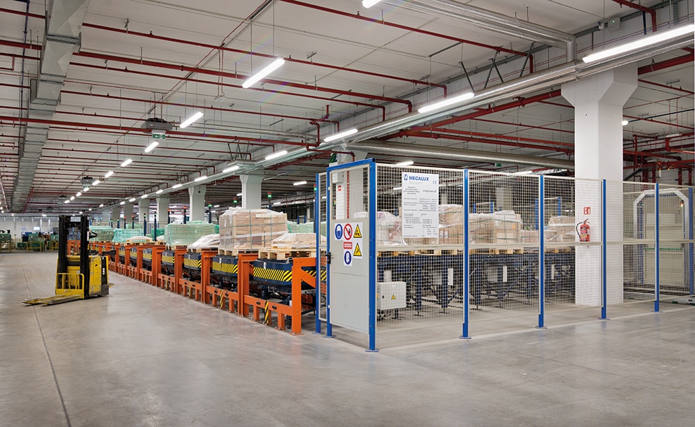 Pallets ready for shipment also leave the warehouse on the lower level and connect to the primary conveyor circuit Pallets ready for shipment also leave the warehouse on the lower level and connect to the primary conveyor circuit