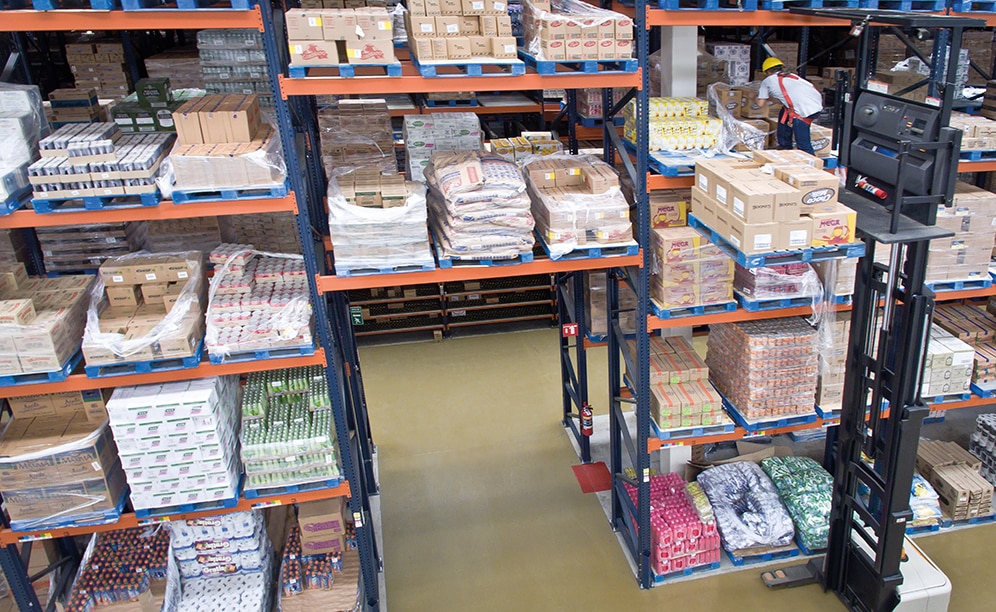 With the help of high reaching order pickers, operators begin to prepare orders by picking directly from the pallet