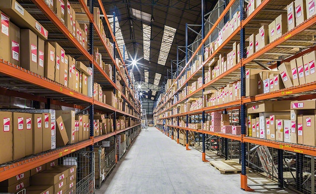 The sides of the warehouse are lined with pallet racks for over-sized products