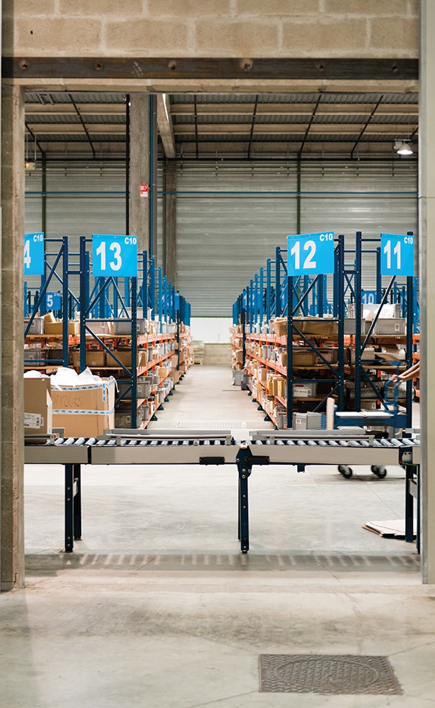 The hinged conveyor section can open so that operators may cross from one area to another