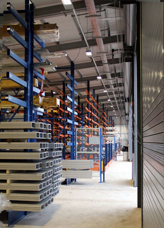 The three blocks of mobile rack were interspersed with the stationary cantilever racks for heavy loads that came from the old warehouse