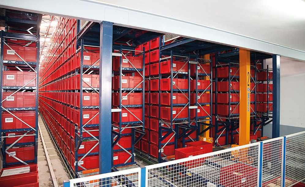 This automated miniload warehouse is comprised of fourteen linear racks served by seven stacker cranes