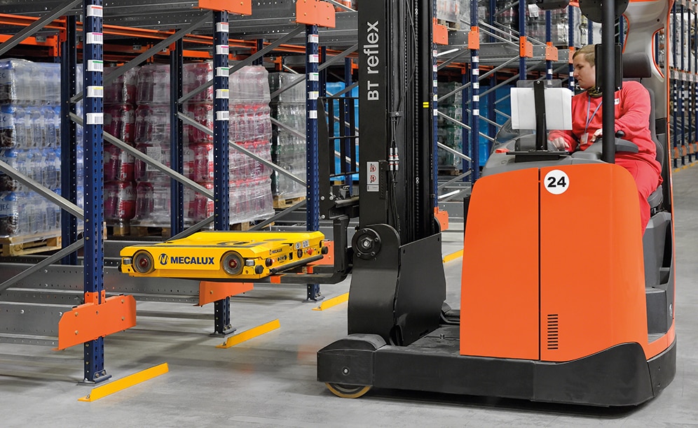 The forklifts are used to place the Pallet Shuttle in the desired channel