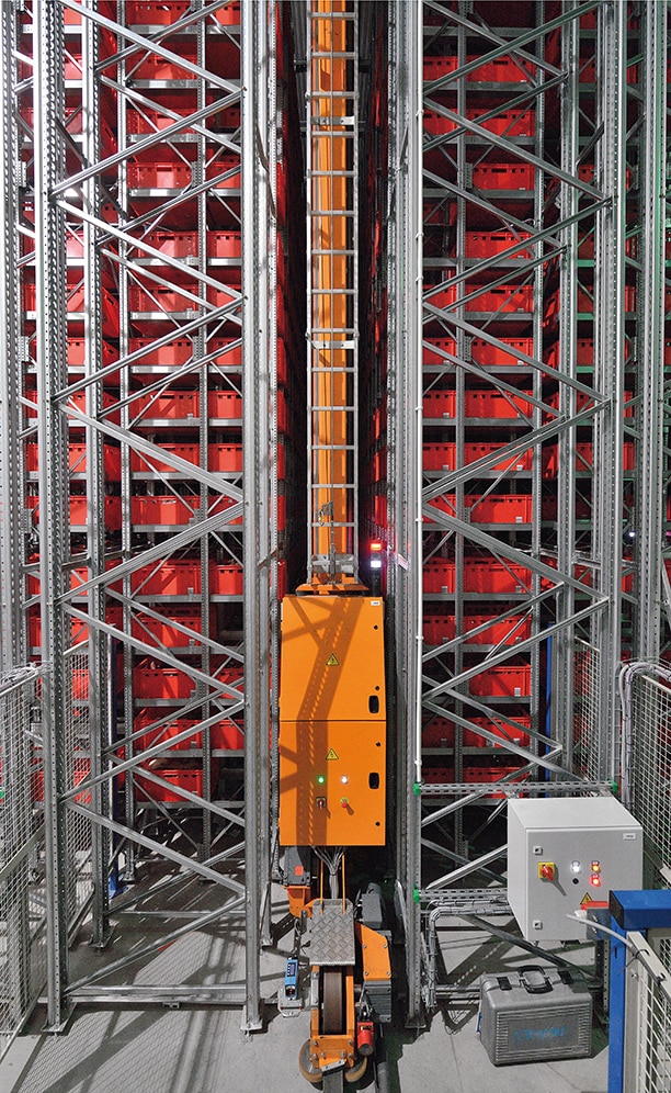 A miniload stacker crane, fitted with double-depth extractors, moves along each aisle two boxes at a time